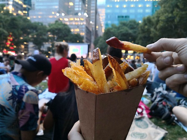 Vibrant local lifestyle and outdoor dining near 260 Madison Avenue, showcasing the building's proximity to Bryant Park and the diverse culinary offerings of Midtown Manhattan.