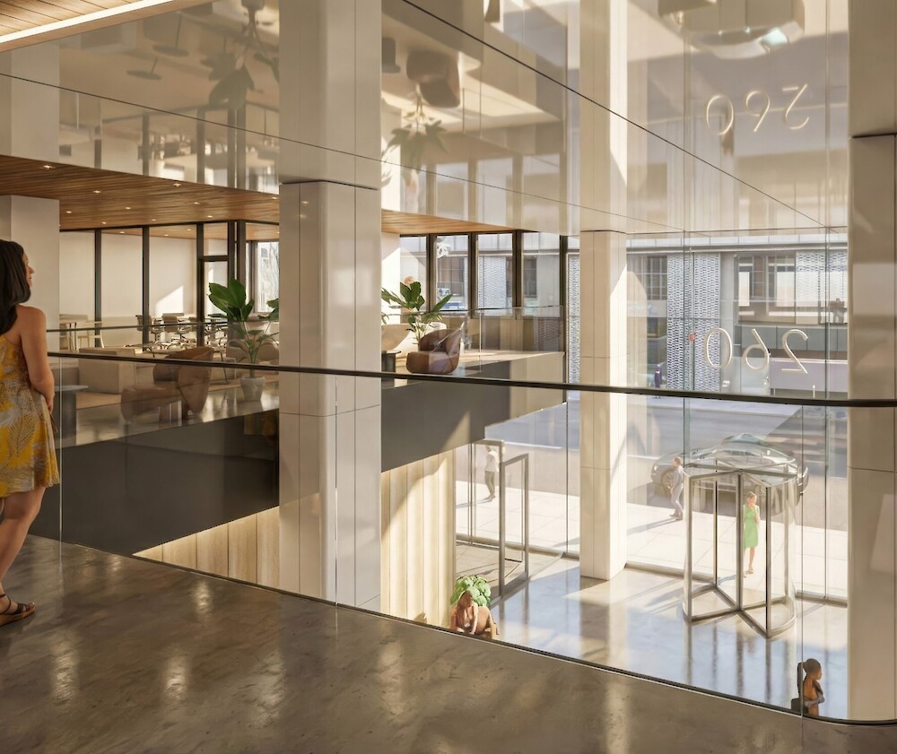Mezzanine view of the modernized 260 Madison Avenue lobby and glass entrance in Midtown Manhattan.
