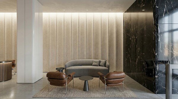 Luxury tenant lounge at 260 Madison Avenue featuring mid-century modern furniture, marble accents, and designer lighting in a Midtown Manhattan office building