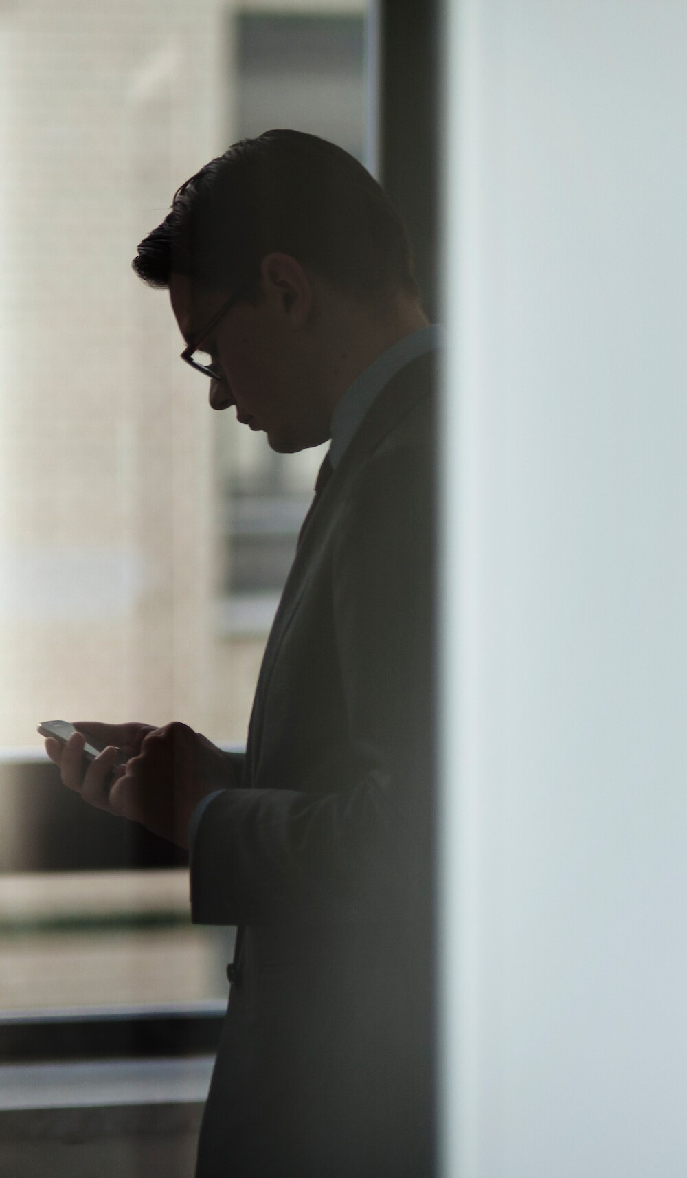 A professional office setting at 260 Madison Avenue featuring two executives in a collaborative environment, highlighting the modern, high-tier corporate atmosphere of the building's available suites.
