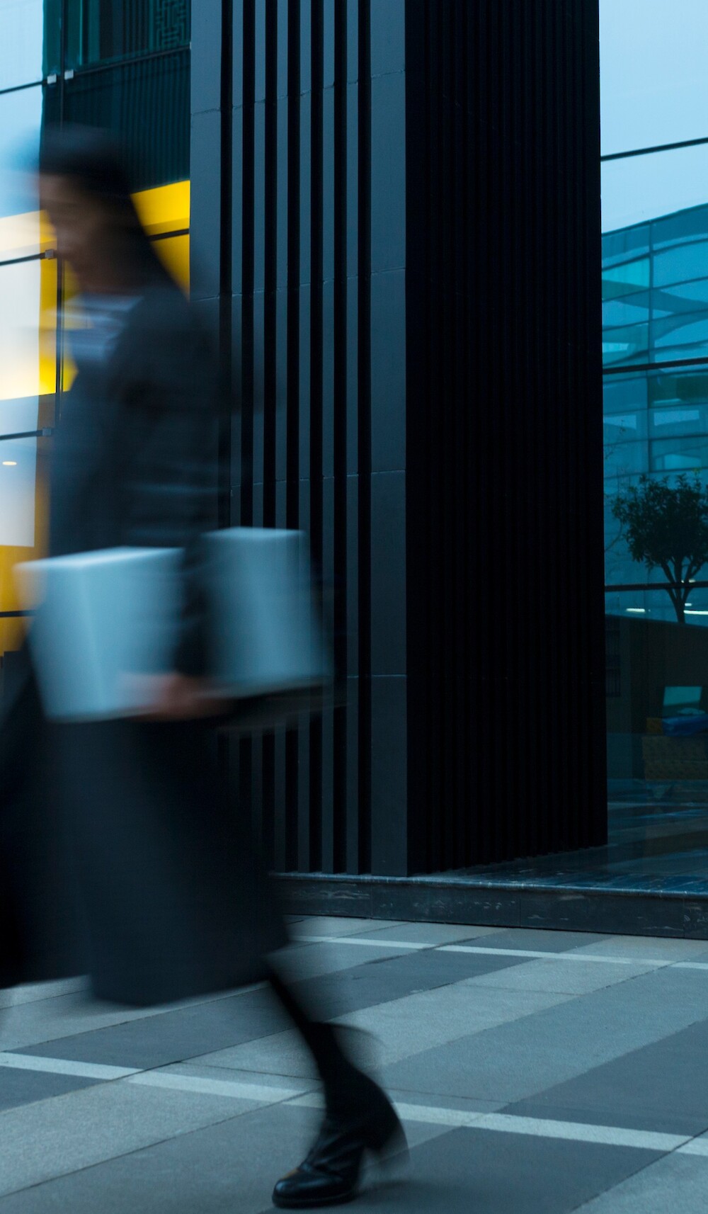 A professional in motion outside 260 Madison Avenue, an office building in Midtown Manhattan, showcasing its street-level activity and accessibility.